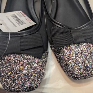 Accessorize Black Flats with Modern Elegance